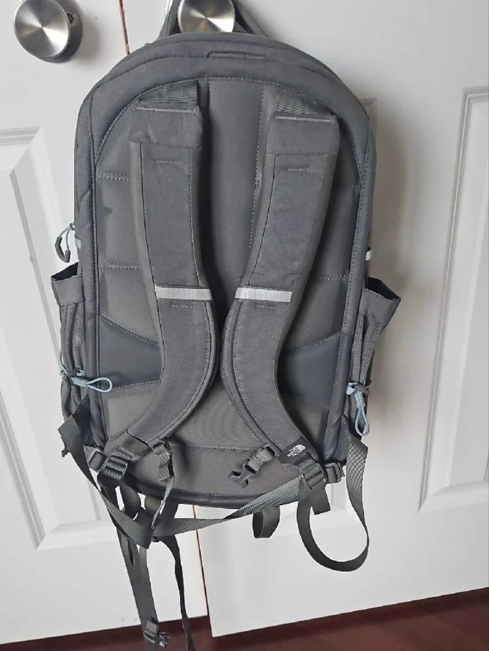 The North Face Grey Backpack with Light Blue Bungee Cord